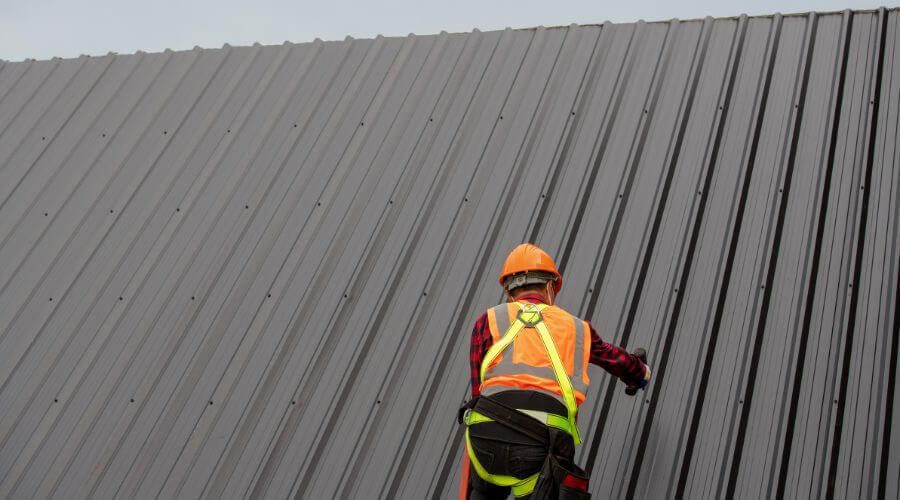 Professional metal roof installation services in Quinton, OK